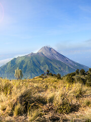 Fototapeta premium View of the peak of mount merapi from the top of mount merbabu central java