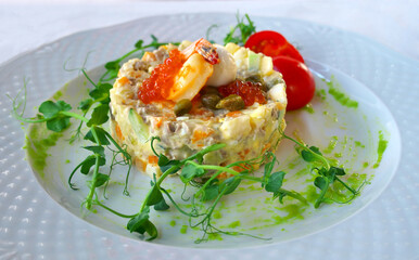 Olivier salad with red caviar and shrimps.