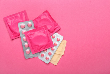Obraz na płótnie Canvas Different contraceptives on color background
