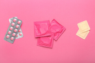 Different contraceptives on color background