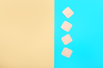 Contraceptive patches on color background