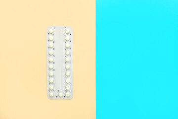 Strip of birth control pills on color background