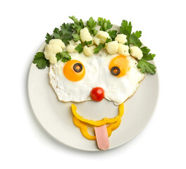 Creative breakfast for children with eggs and fresh vegetables on white background