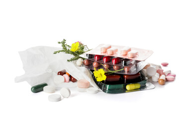 Pills, flowers and used tissue on white background