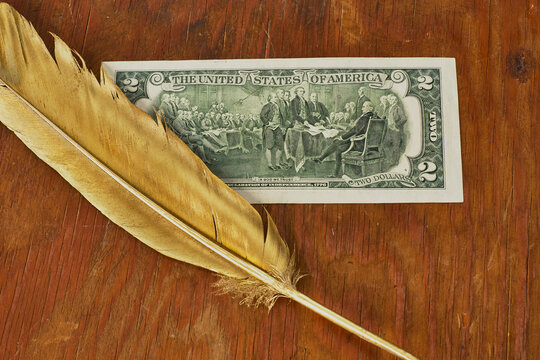 Gold Quill Pen And Picture Of Signing US Declaration Of Independence In Two Dollars Banknote