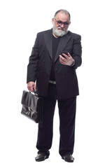 friendly business man with briefcase and smartphone .