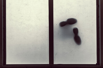 view from below at the feet standing on the glass