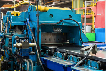 Fototapeta na wymiar Roller forming machine. The interior of the plant producing a metal profile.