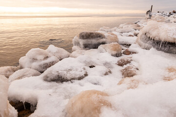 Tuja coast of Vidzeme sea shore Rīgas jūras līcis Gulf of Riga winter frozen water landscape sunset horizon  - obrazy, fototapety, plakaty