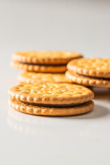 Close up of Sandwich biscuits cookies with chocolate filling on white background