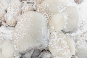 frozen water on rocks texture close up 