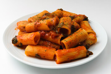 Rigatoni pasta on white background