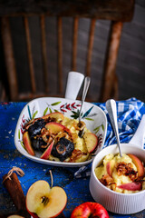 Fried blood sausage with mashed potatoes, apples and fried onions.style rustic