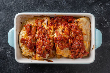 Traditional stuffed cabbage with minced meat and rice, served in a tomato sauce