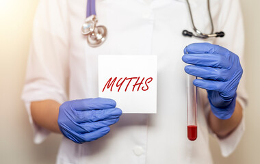Medical myths concept. Inscription, word about fakes and misinformation about health and blood...
