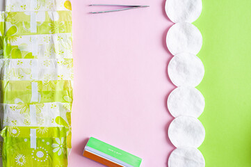Women's hygiene items on a bright background. Pink and green. Women's day.