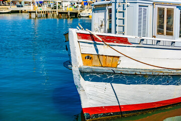 Fototapeta na wymiar A vintage sightseeing tourist boat is tied the the jetty at Williamstown, Melbourne, Australia