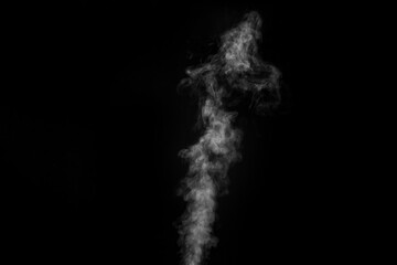 Curly white steam rising up isolated on a black background. Fog backdrop for your photos.