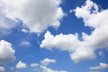 Naklejka na ściany i meble White cloud on blue sky on sunny day