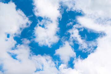 Obraz premium White clouds on bright blue sky and space background