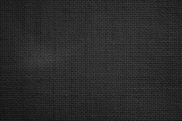 Jute hessian sackcloth canvas woven texture pattern background in light black color blank empty.