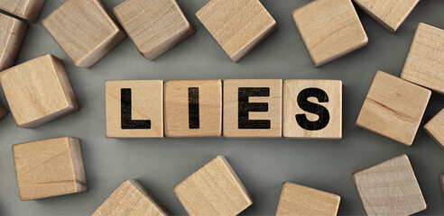 lies - word concept from wooden blocks. Top view