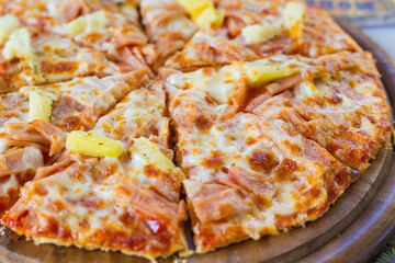 Hawaiian pizza is a Italian food which it made with tomato sauce, chopped pineapple, ham and cheese.
