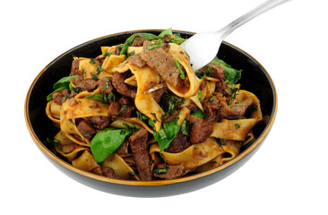 Steak ragu with pappardelle pasta isolated on a white background