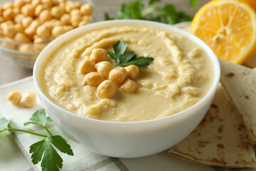 Fototapeta premium Concept of tasty eat with bowl of hummus, close up