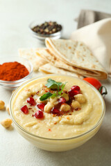 Concept of cooking hummus on white textured background