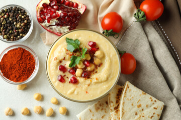 Concept of cooking hummus on white textured background
