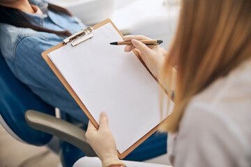 Close up of dentist that making notes