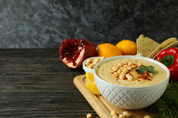 Concept of cooking hummus on wooden background
