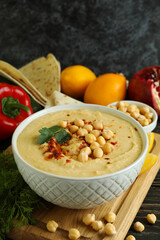 Concept of cooking hummus on wooden background
