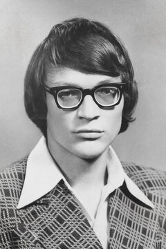 Portrait Of Young Soviet Guy With Glasses, In Checkered Jacket. Vintage Black And White Paper Photo, 1970s. Transferred Property, Family Archive. Outdated Quality