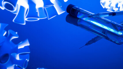 Vaccine isolated. Medical syringe with needle for protection flu virus and coronavirus. Covid immunization isolated on blue. Concept fight against virus covid-19.