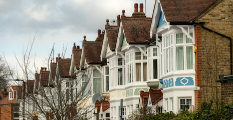 Ealing, West London: Row of typical terraced period properties with bay windows 