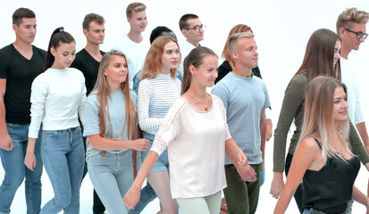 group of successful young people stepping forward
