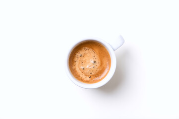 Cup of coffee on bright background. Top view.