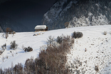 Aerial scenic rural view over Pestera village at the bottom of Piatra-Craiului Mountains during a...