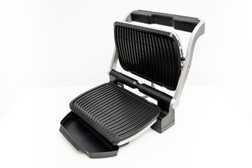 electric grill with open lid. appliance for cooking in everyday life. Made of stainless steel,...