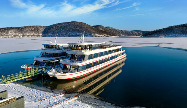 Beautiful snowy landscape with excurision ship at the Edersee in winter.