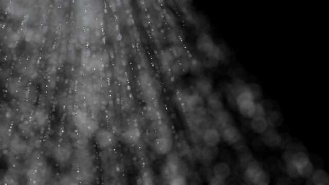 Shower water is flowing in slow motion, macro shot. The shower is turned on, the stream goes down infinity. Viedo is loopable. 
