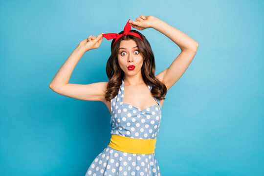 Portrait of cute pretty sweet youth girl fix her hairdo impressed by pin-up retro style scream wow omg wear good look skirt isolated over blue color background