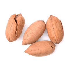 Peeled pecan nuts closeup, isolated on white background