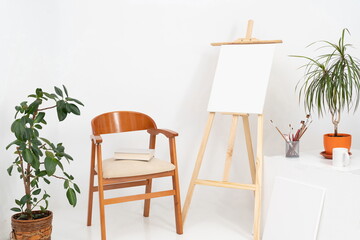 Painting studio with blank canvases and on white background with copy space