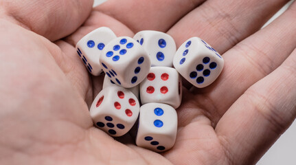 White game cubics in hand. Concept of luck, chance and leisure fun.