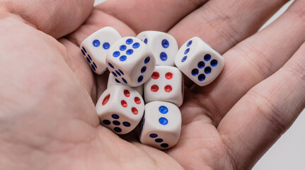 White game cubics in hand. Concept of luck, chance and leisure fun.