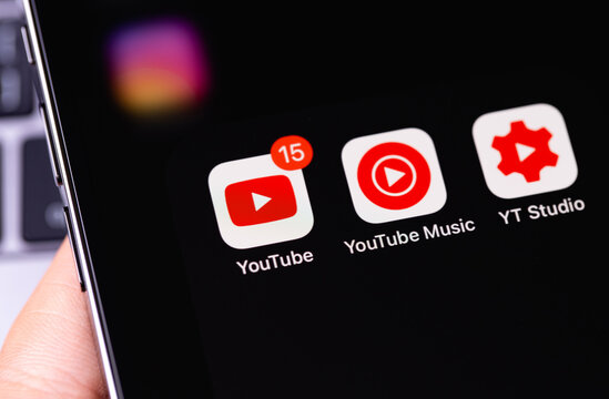 YouTube mobile apps (YouTube, Music, Studio) on screen smartphone closeup. YouTube is a free video sharing application that anyone can watch. Moscow, Russia - December 5, 2020