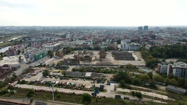 Round view of Poznan Garbary district. Beautiful Poznan from a drone. Drone shot of city Poznan, Poland with river Warta in the middle. Different kind of buildings in the urban city.